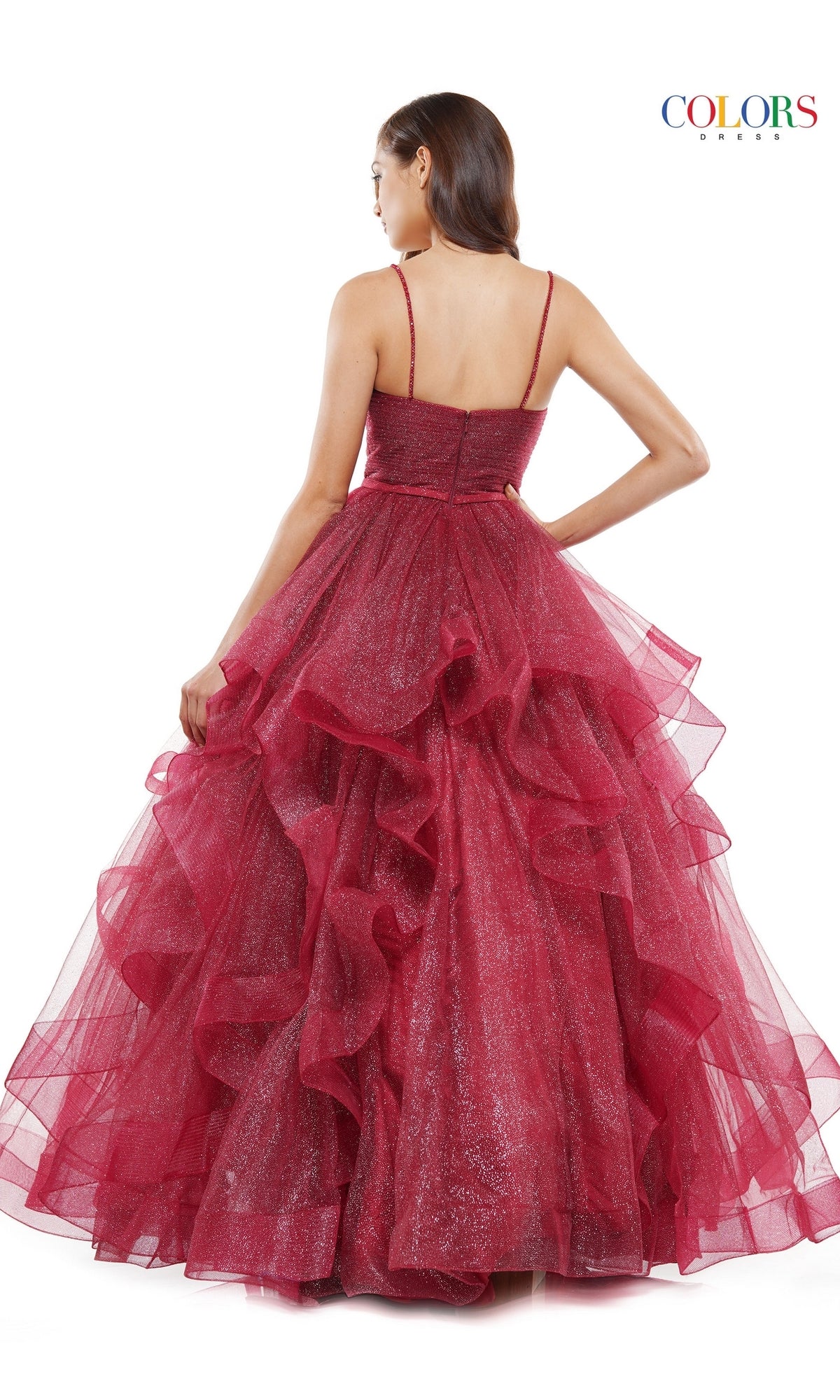 A woman faces away, wearing the Layered Long Tulle Prom Ball Gown 2381—a sparkly deep red formal dress with thin straps, layered ruffles, and an a-line tulle skirt. The background is plain white with a